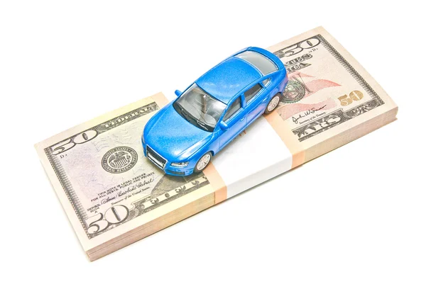 Blue car on dollar notes — Stock Photo, Image