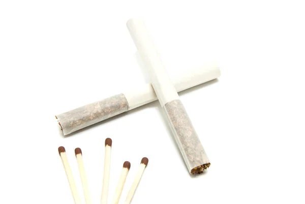 Two cigarettes without filter and few matches — Stock Photo, Image