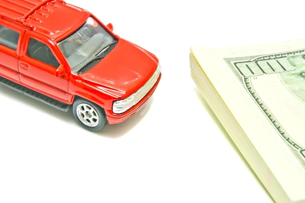 Red car and dollar notes on white — Stock Photo, Image