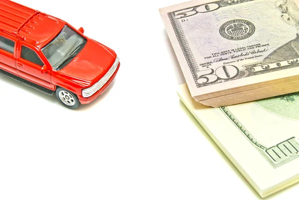 Dollar notes and red car — Stock Photo, Image