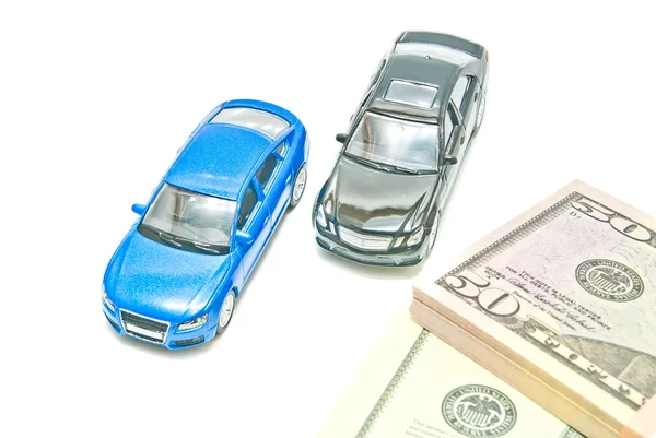 Blue and black cars near the bills — Stock Photo, Image