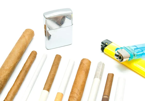 Many cigars, lighters and cigarettes — Stock Photo, Image