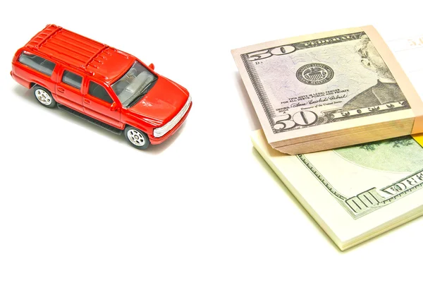 Single red car and dollar notes on white — Stock Photo, Image