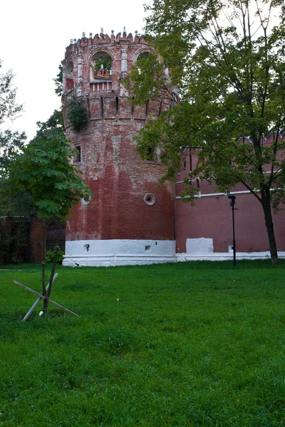 Wall of the old monastery with tower — Stock Photo, Image