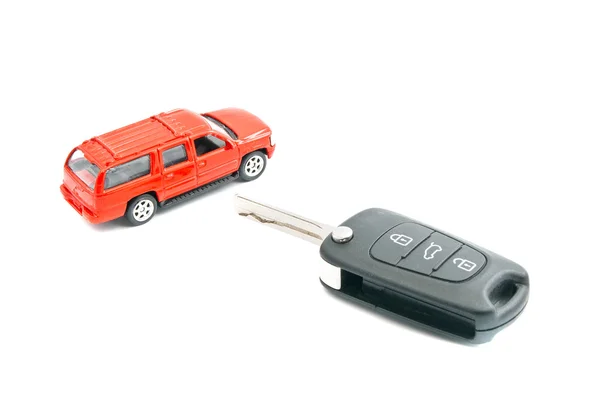 Red car and keys on white — Stock Photo, Image