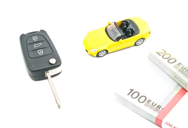 Car with keys and notes on white — Stock Photo, Image