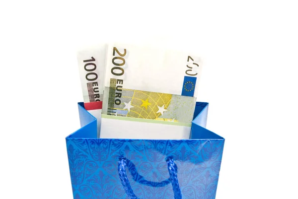 Blue gift bag with banknotes closeup — Stock Photo, Image