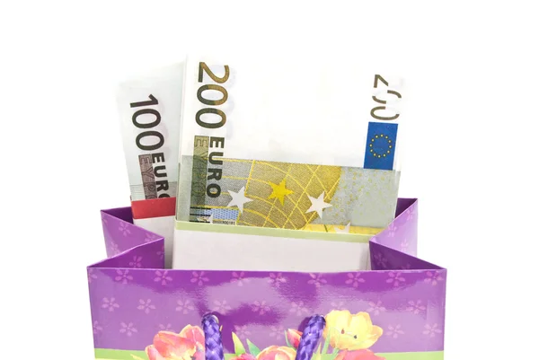Colorful gift bag with banknotes closeup — Stock Photo, Image