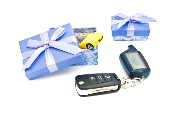 Car keys, sport car and blue gift boxes — Stock Photo, Image
