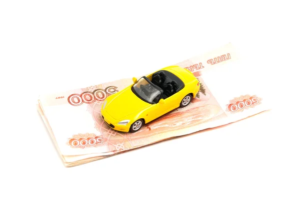 Billetes rusos y coche amarillo — Foto de Stock