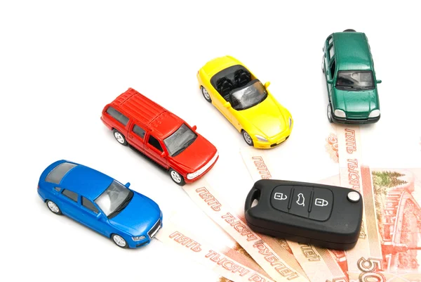 Quattro auto, chiavi e banconote russe Fotografia Stock