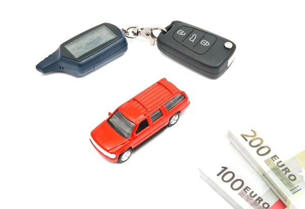 Red car, notes and keys on white — Stock Photo, Image