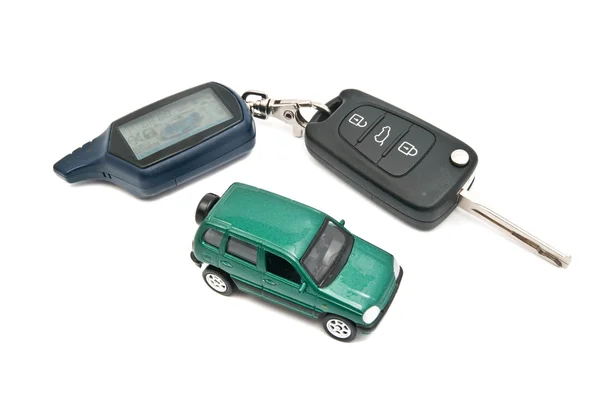 Car and keys with alarm on white — Stock Photo, Image