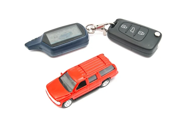 Red car and keys on white — Stock Photo, Image