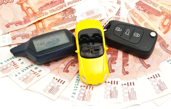 yellow car, keys and banknotes