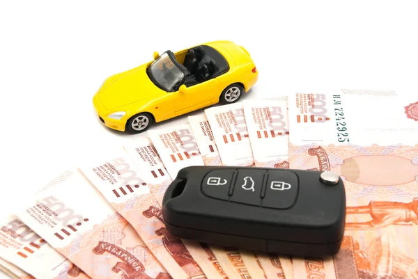 Yellow car, banknotes and keys — Stock Photo, Image