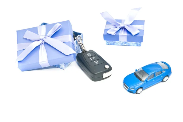 Two gift boxes, blue car and keys — Stock Photo, Image