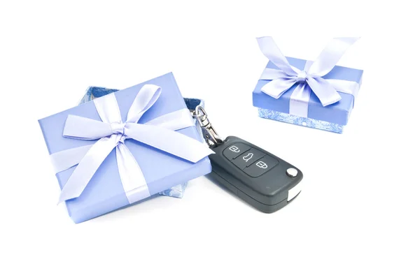 Two gift boxes and car keys — Stock Photo, Image