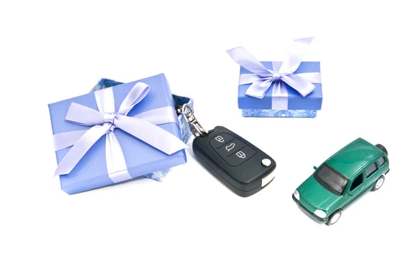 Two gift boxes, green car and keys — Stock Photo, Image