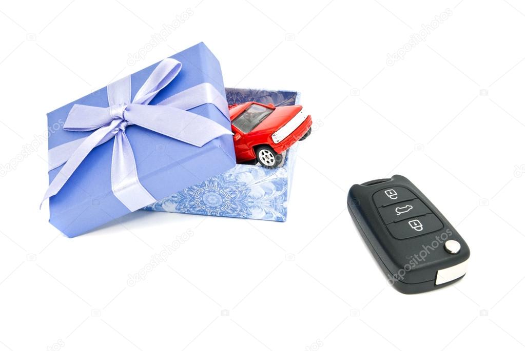 red car, keys and blue gift box