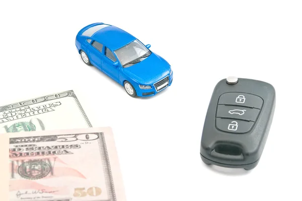 Blue car, black car keys and dollar banknotes — Stock Photo, Image