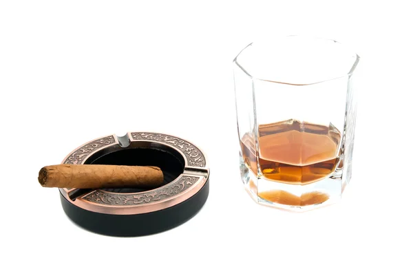 Cigar in ashtray and cognac on white — Stock Photo, Image