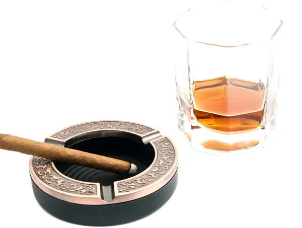 Cigarillo in ashtray and alcohol on white — Stock Photo, Image