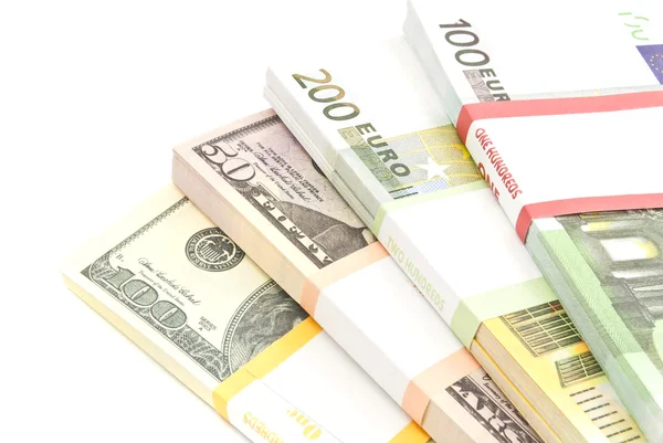 Fyra förpackningar med euro och dollar sedlar — Stockfoto