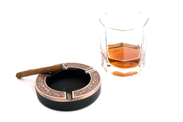 Cigarillo in metal ashtray and cognac — Stock Photo, Image