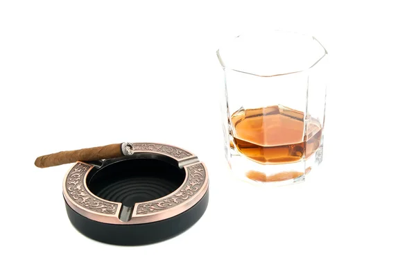 Cigarillo in ashtray and cognac — Stock Photo, Image