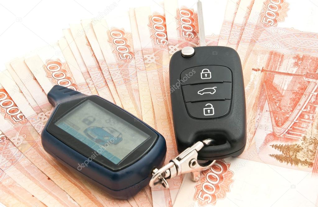 Russian rubles notes and car alarm