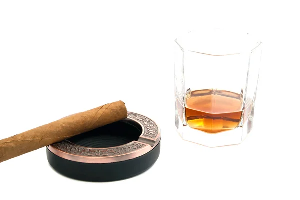 Cigar in ashtray and glass of alcohol — Stock Photo, Image