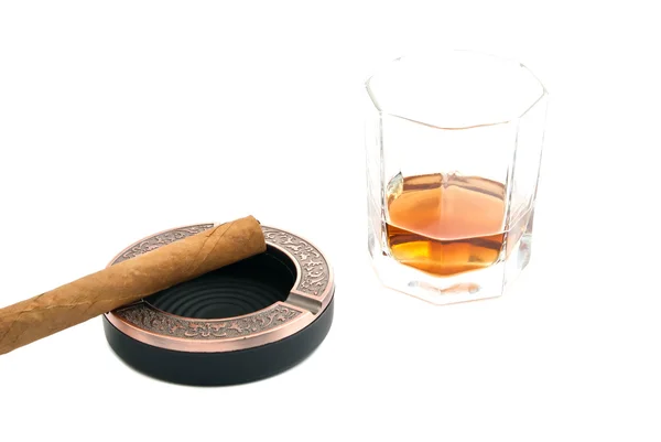 Cigar in ashtray and alcohol on white — Stock Photo, Image