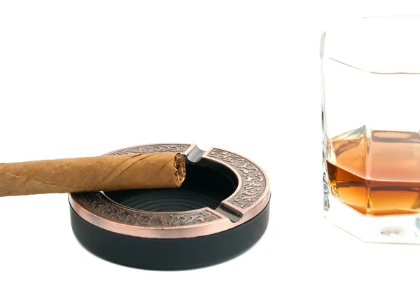 Cigar in metal ashtray and glass of whiskey — Stock Photo, Image