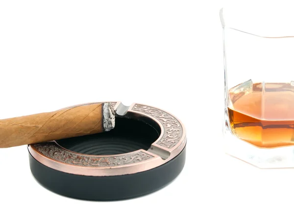 Cigar in ashtray and glass of whiskey on white — Stock Photo, Image