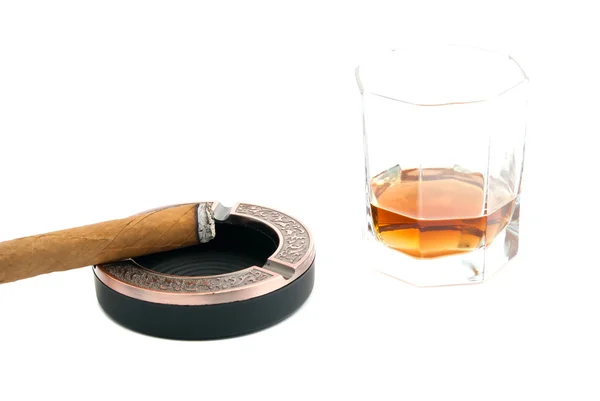 Cigar in ashtray and glass of whiskey — Stock Photo, Image