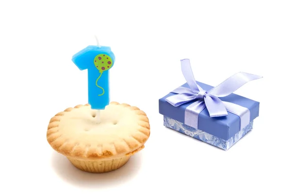 One years birthday candle with cupcake and gift — Stock Photo, Image