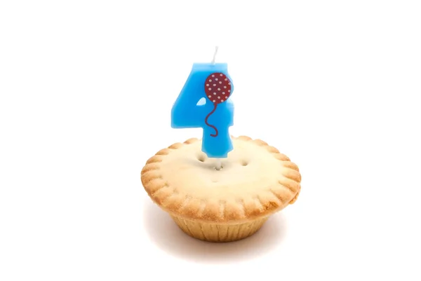 Cupcake and four years birthday candle — Stock Photo, Image