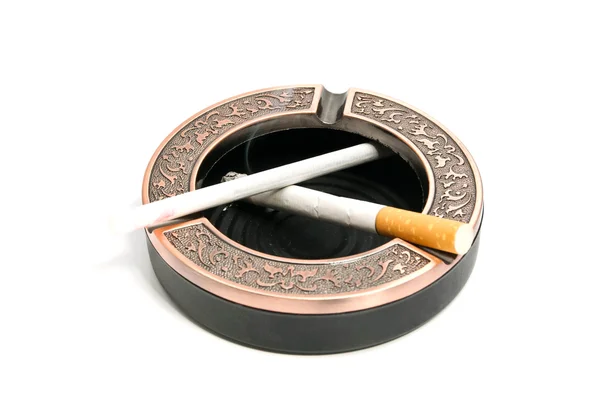 Two different cigarettes in metal ashtray — Stock Photo, Image