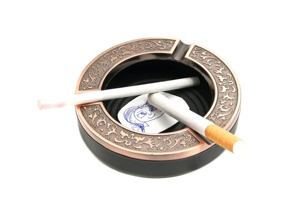 Ashtray with cigarettes and portrait of child — Stock Photo, Image