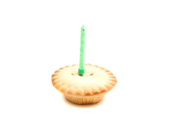 Cupcake com vela de aniversário verde — Fotografia de Stock