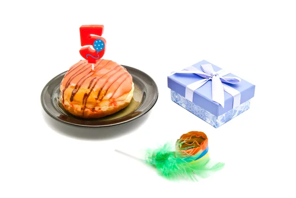 Donut with five years birthday candle, gift and whistle — Stock Photo, Image