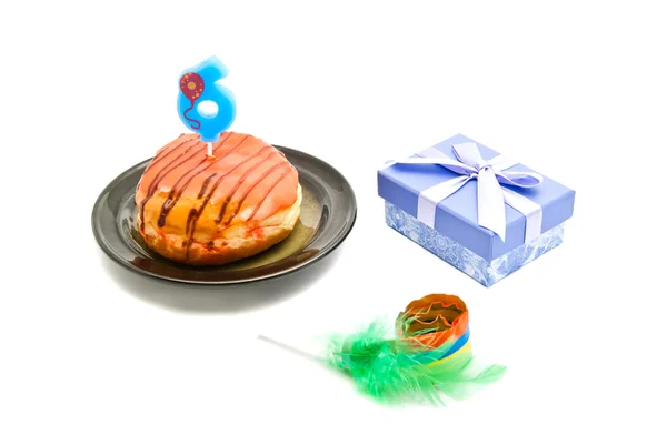 Donut with six years birthday candle, gift and whistle — Stock Photo, Image