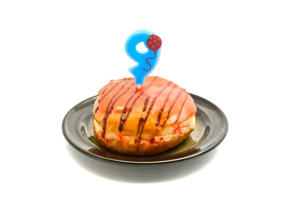 Donut with nine years birthday candle — Stock Photo, Image