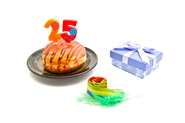 Donut with twenty five years birthday candle, whistle and gift — Stock Photo, Image
