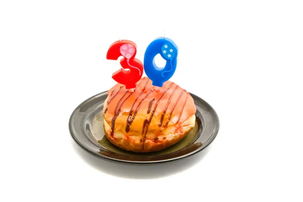 Donut com trinta anos vela de aniversário — Fotografia de Stock