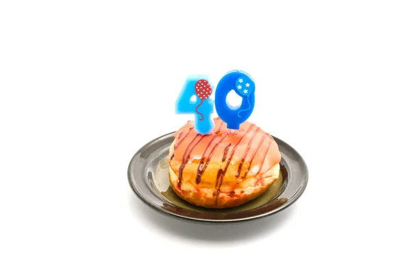 Donut com quarenta anos vela de aniversário — Fotografia de Stock