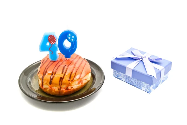 Donut with forty years birthday candle and gift — Stock Photo, Image