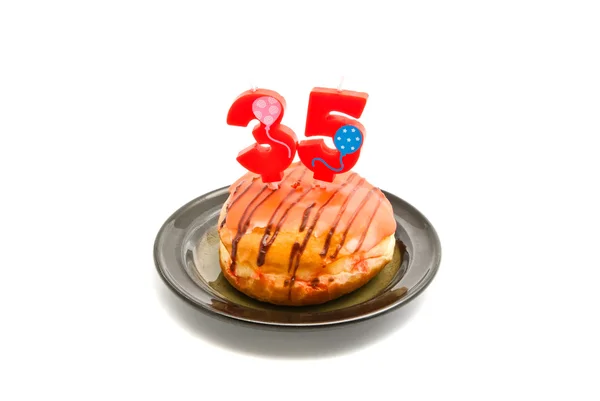 Donut with thirty five years birthday candle — Stock Photo, Image