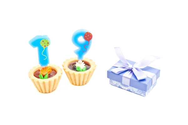 Cakes with nineteen years birthday candles and gift — Stock Photo, Image